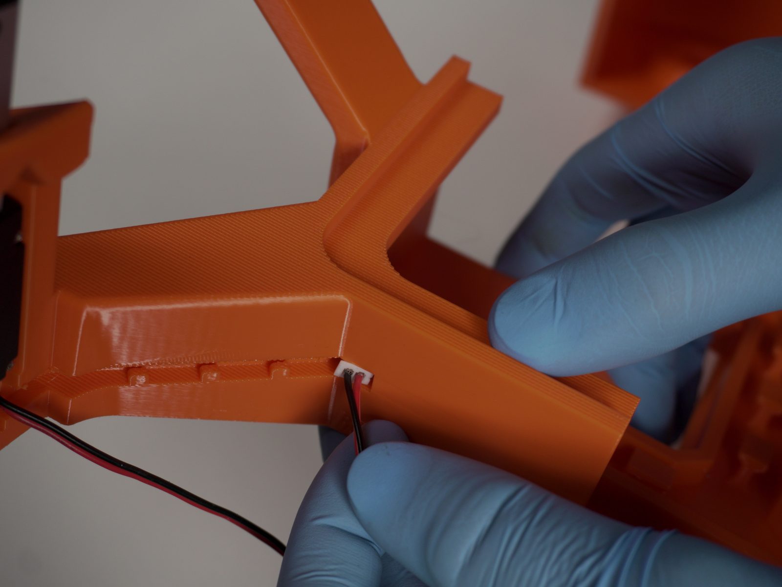 Routing the actuator cable into the cutout channel
