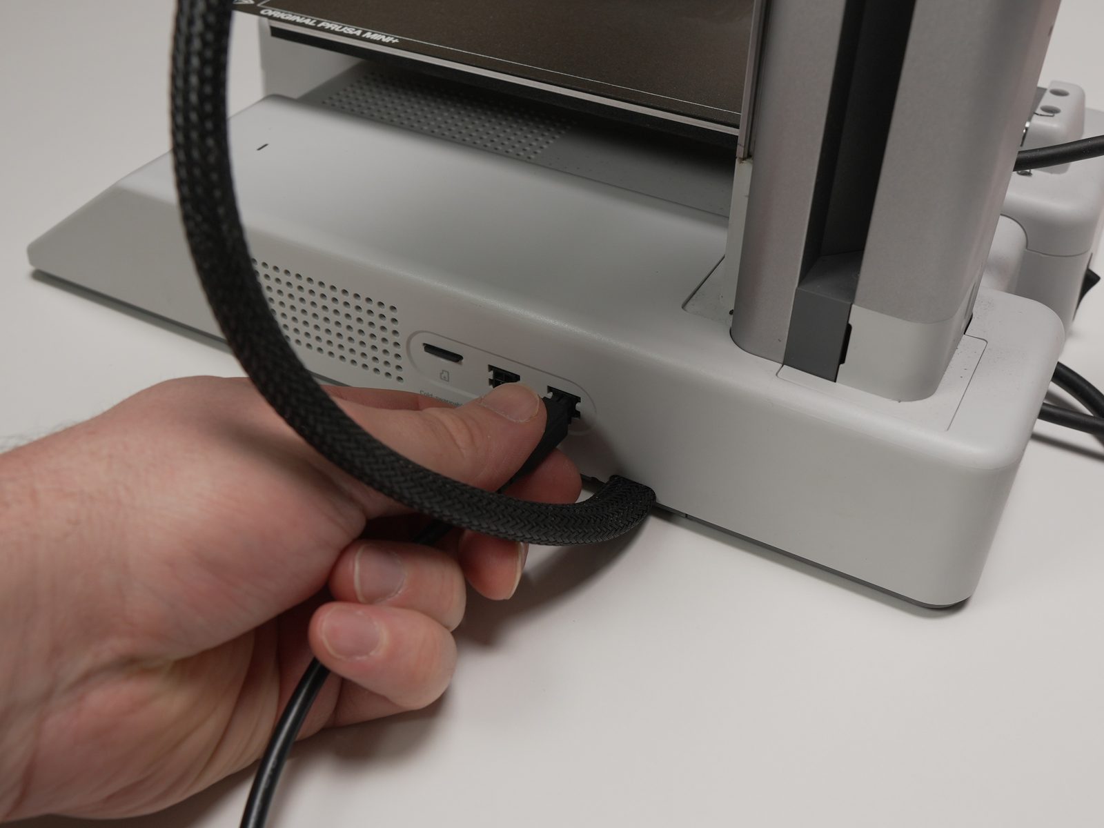 AMS cable plugged into the back of the printer