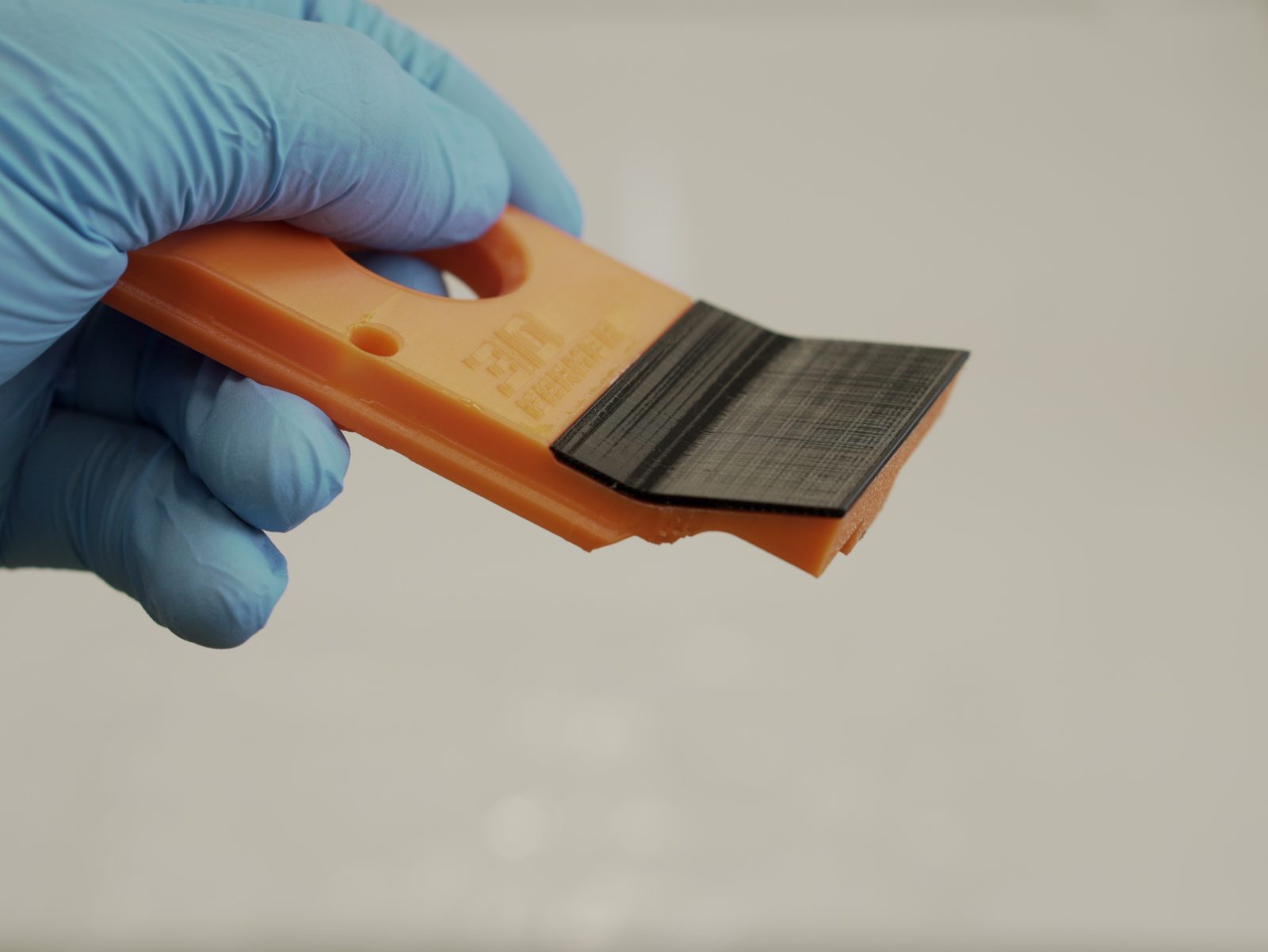 Hooking the FarmLoop scraper into the top hinges