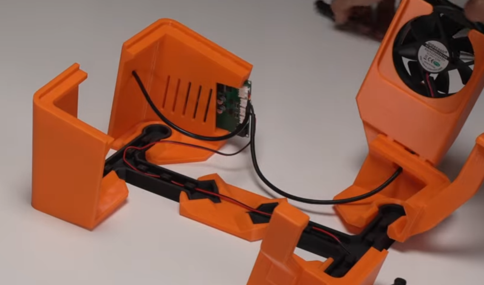 Completed PCB + fan + linear-actuator module, fully wired