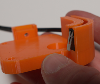 Limit switch seated into the orange printed holder with extension cable attached