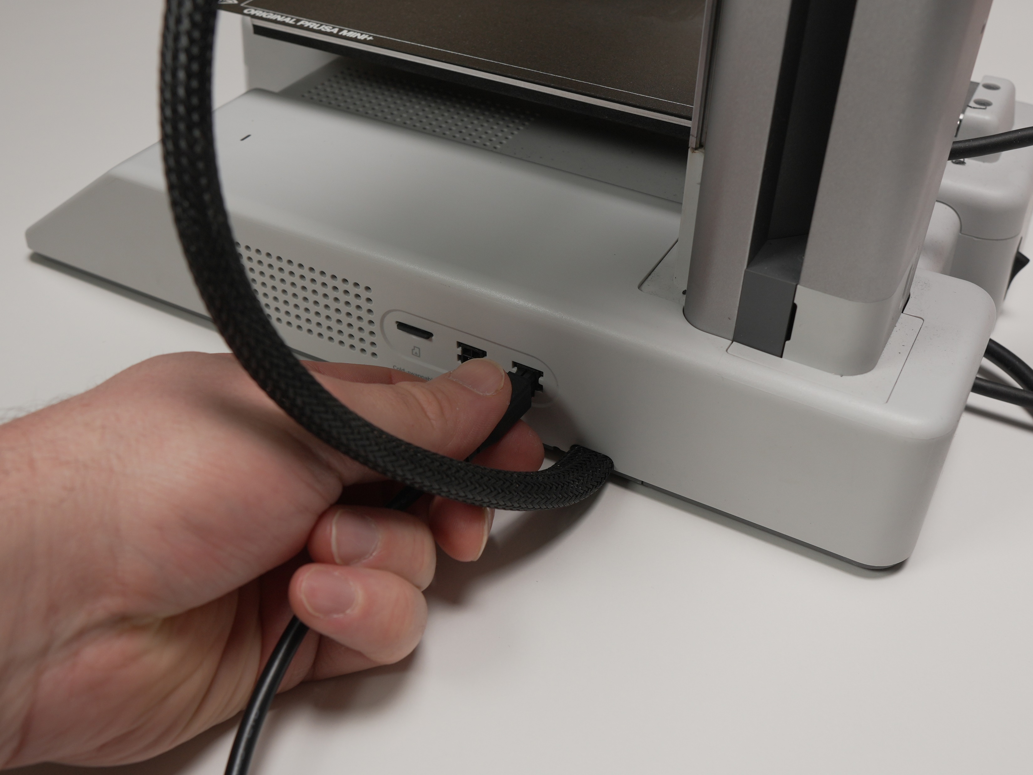 AMS cable plugged into the back of the printer