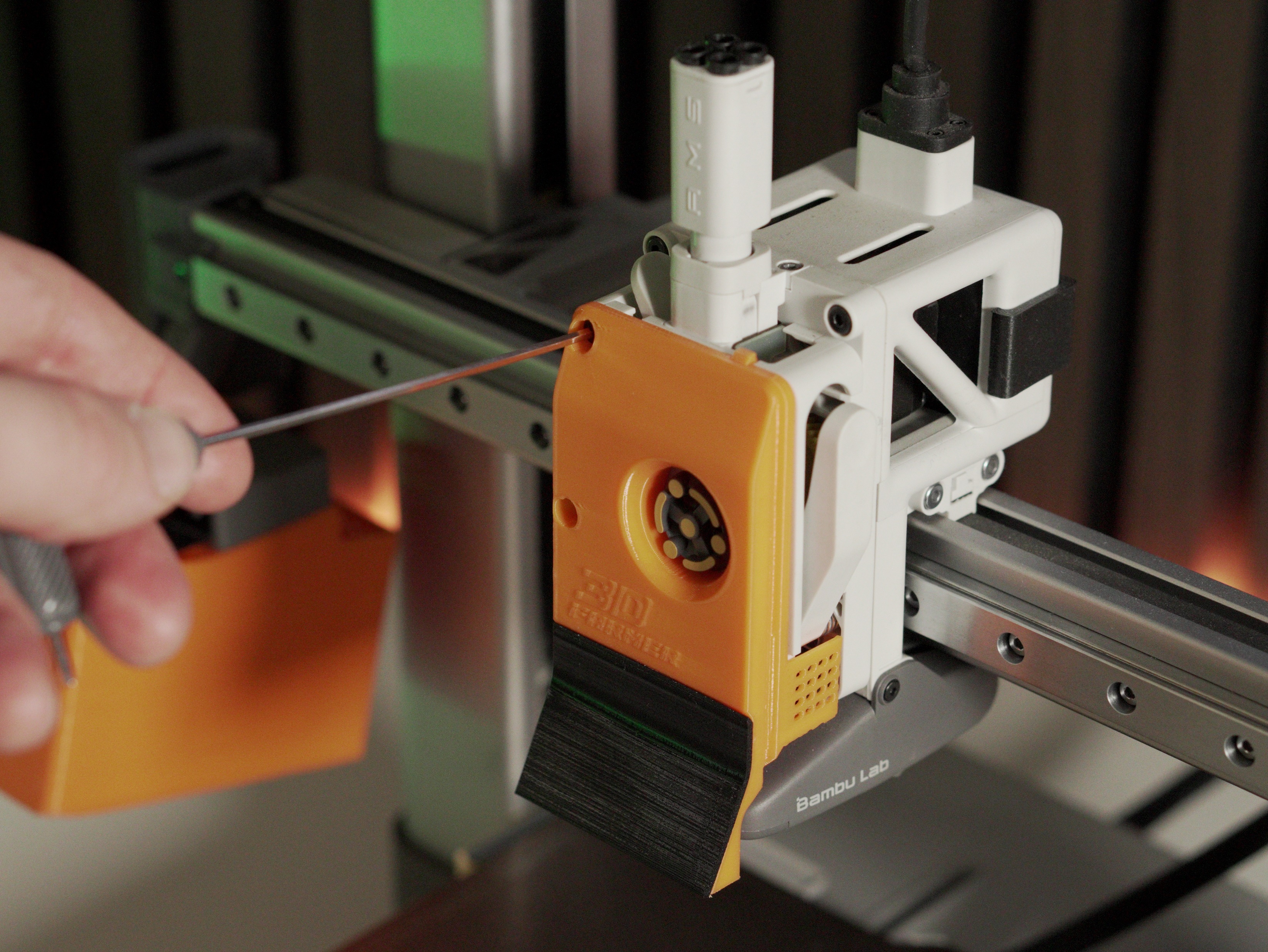 Hooking the FarmLoop scraper into the top hinges