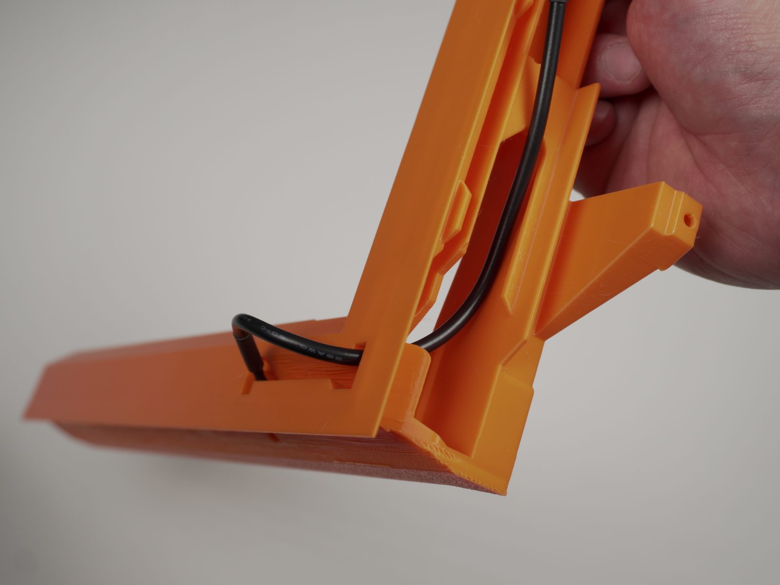 Cable routed the full length through the rail channel