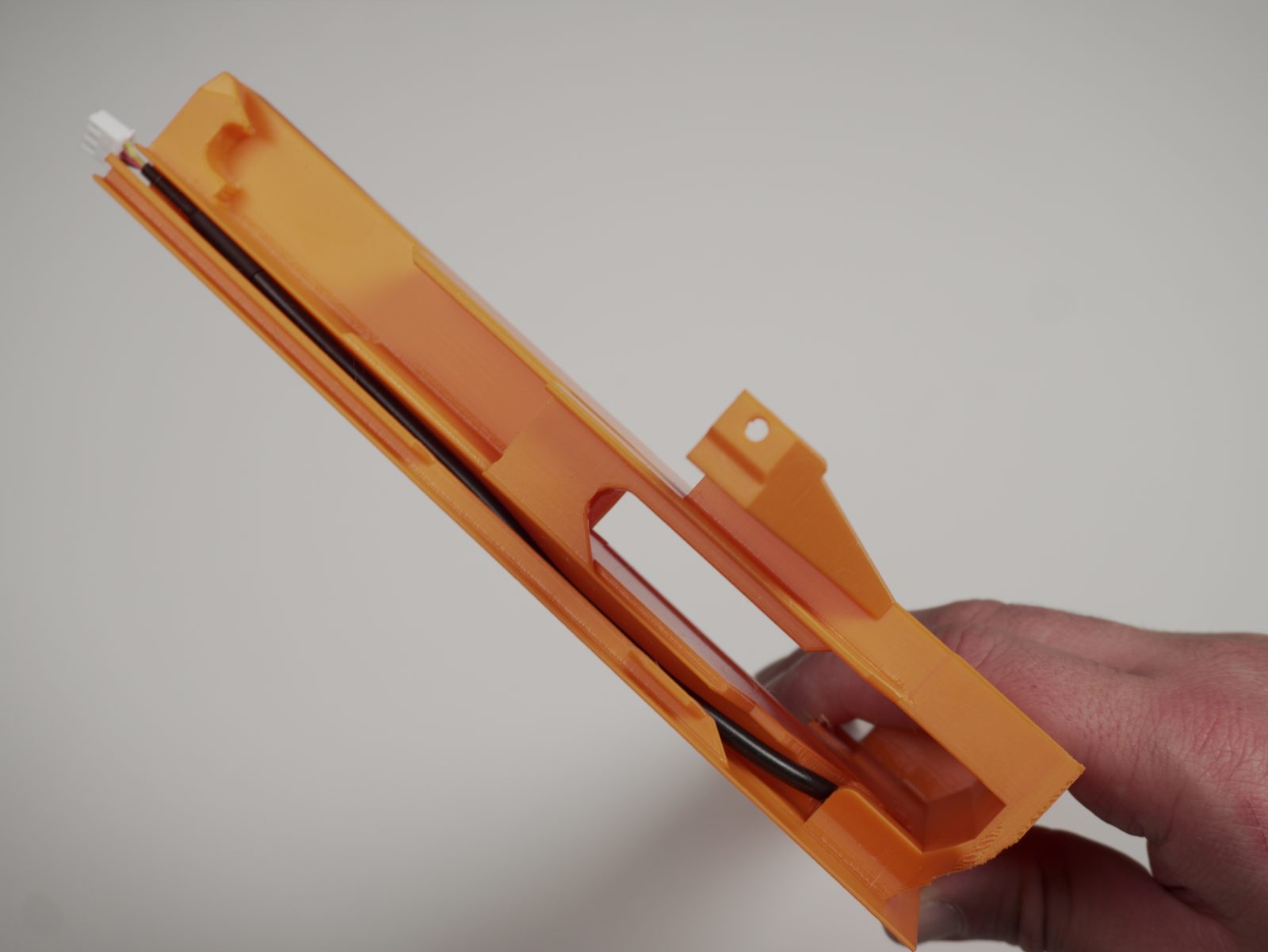Cable routed through the rail, connector visible at the top