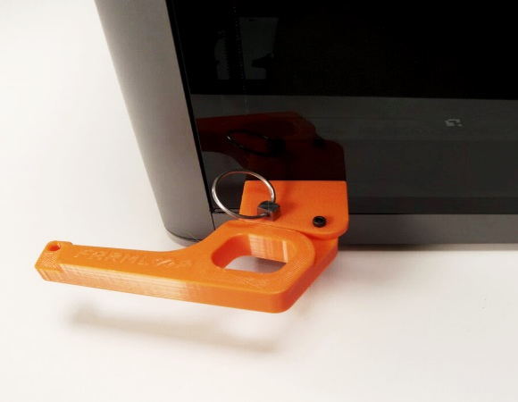 Lid arm attached to the hinge bracket with the quick-release pin inserted
