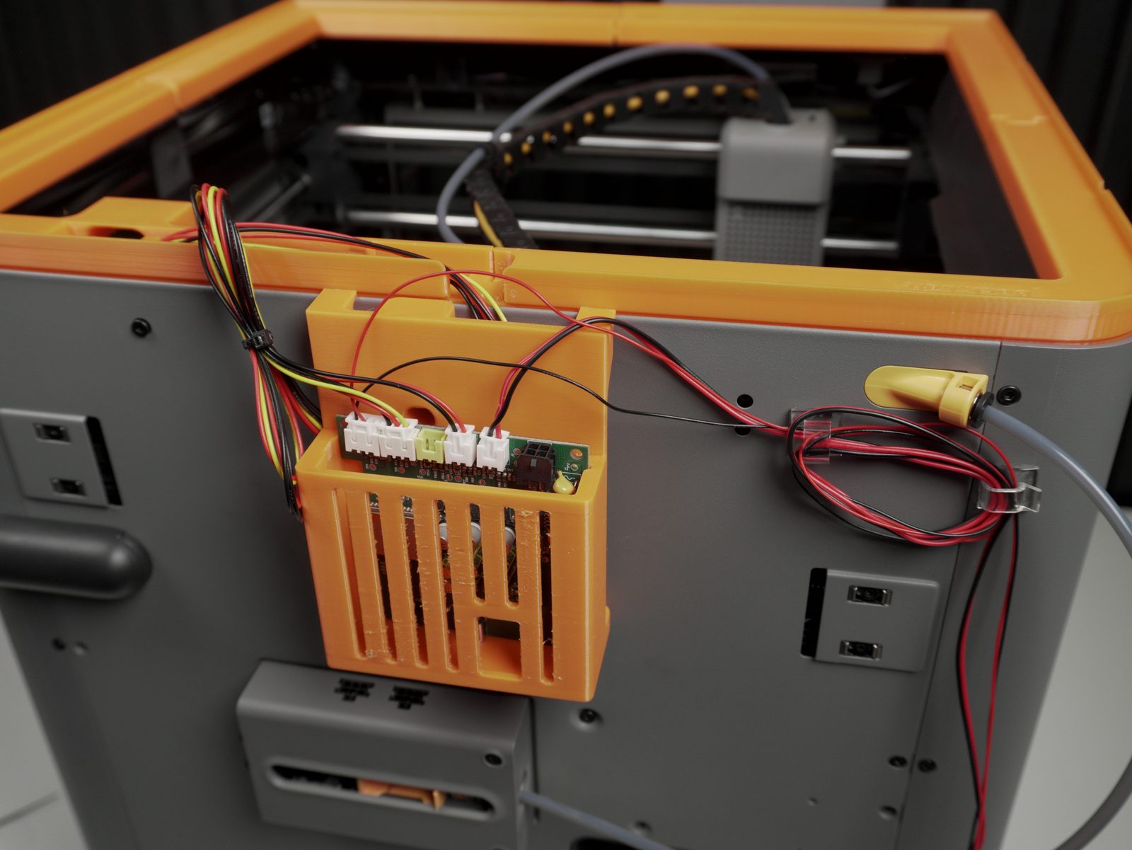 PCB basket mounted on the back of the printer, cables connected