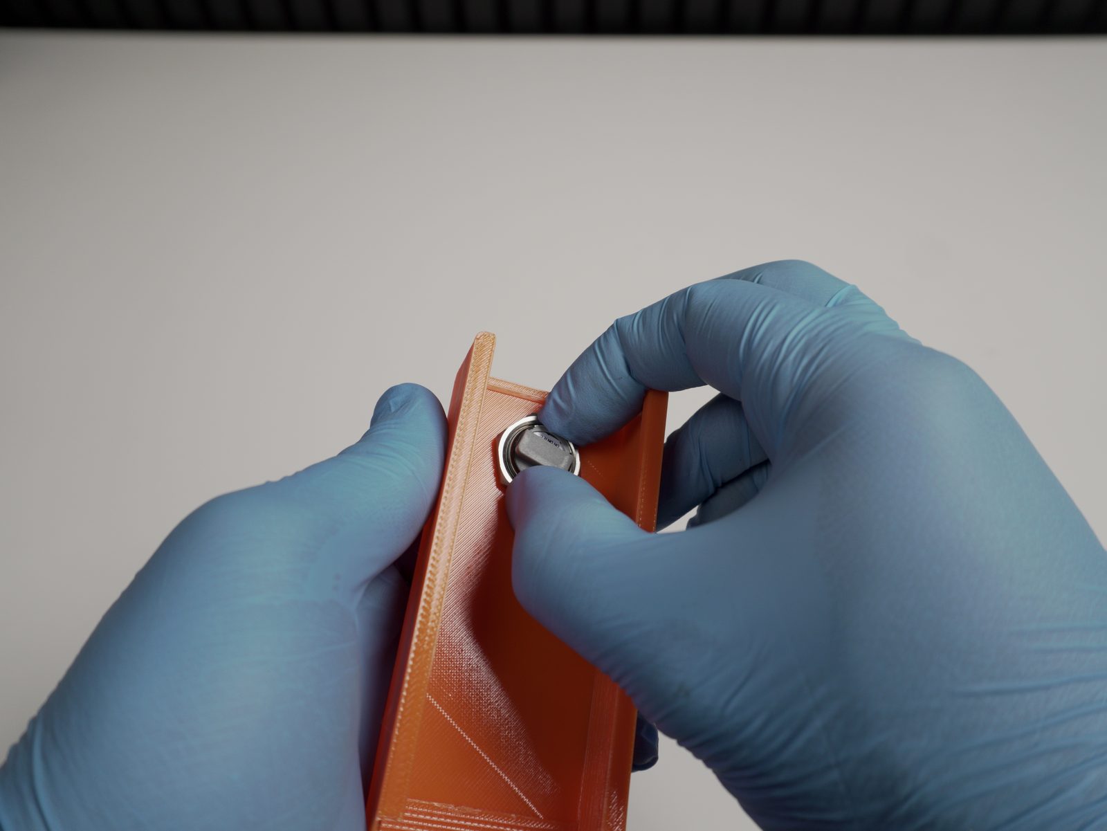 Securing the door-opener button with the hex nut
