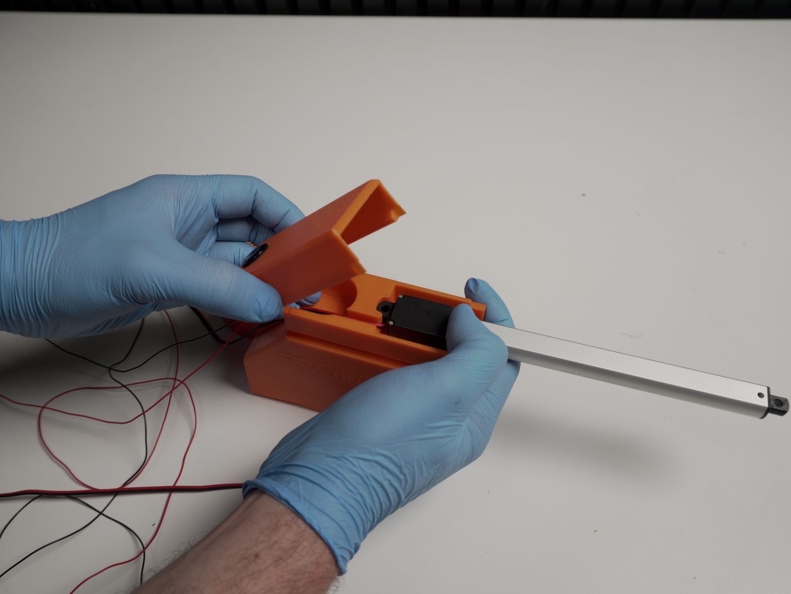 Door actuator inserted into the designated slot, held in place while positioning the cover