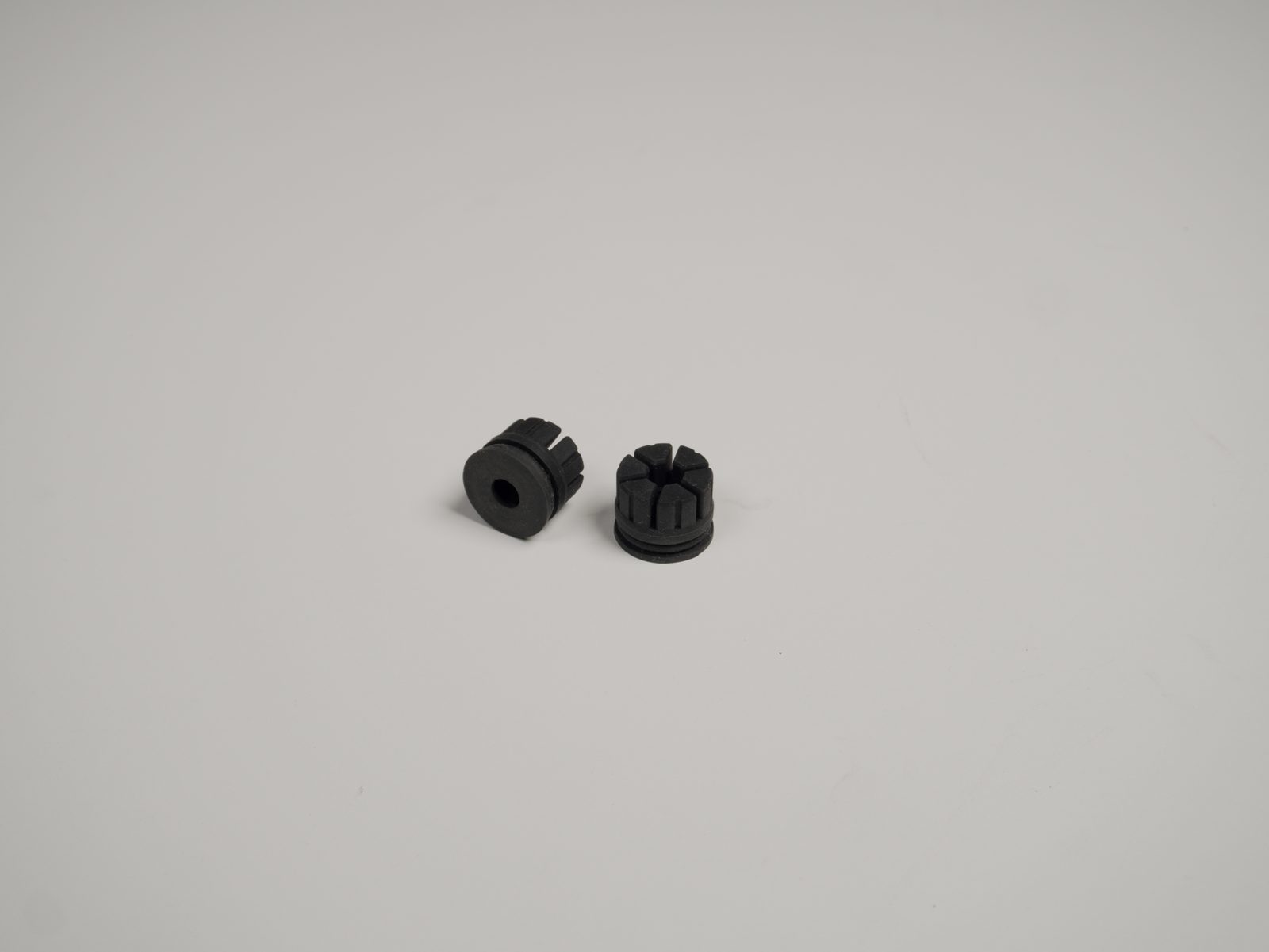 The two rubber feet parts before installation