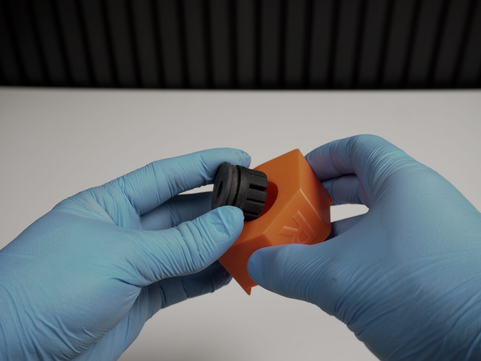 Rubber pad being pressed into the right (R) tilted foot