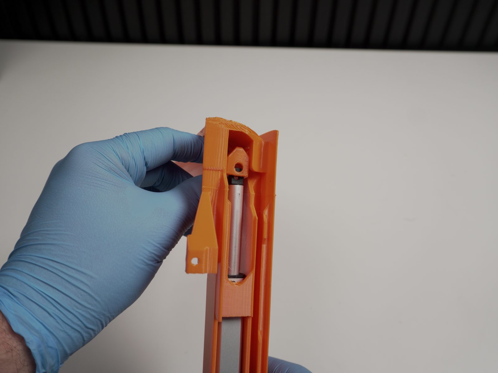 Lifter hook positioned at the top of the bender rail