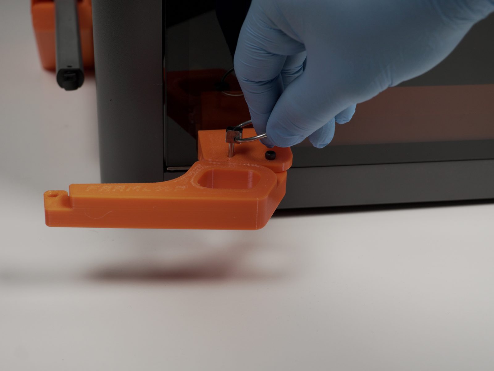 Quick-release pin inserted through the hinge arm