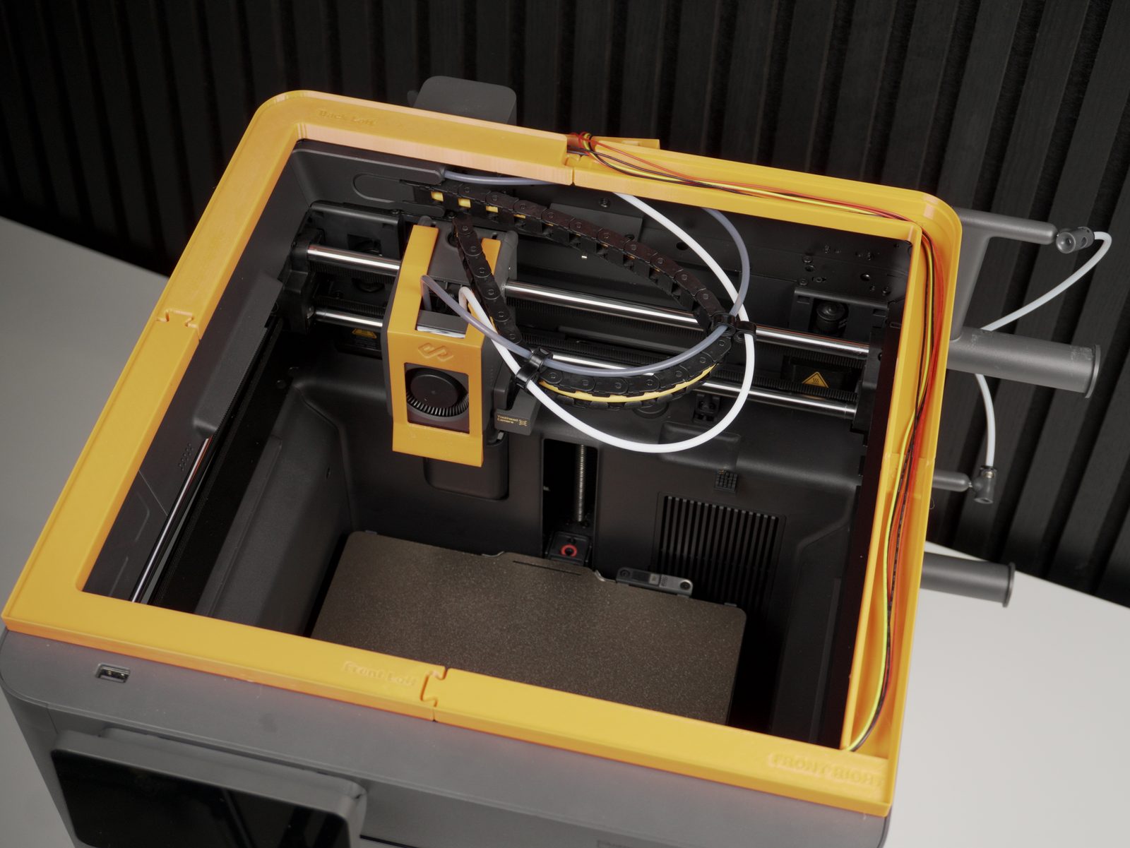 Wire harness threaded through the lid lifter