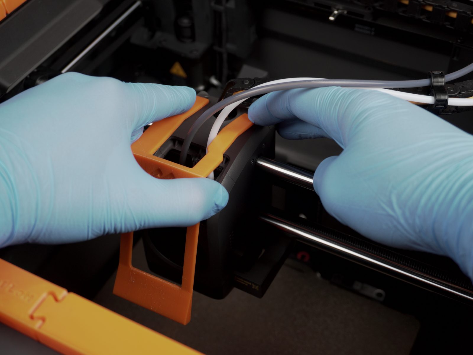 Pressing down on the scraper hooks