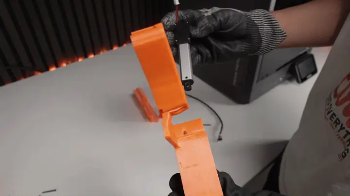 Sliding the actuator into the bender bracket, cable at the bottom