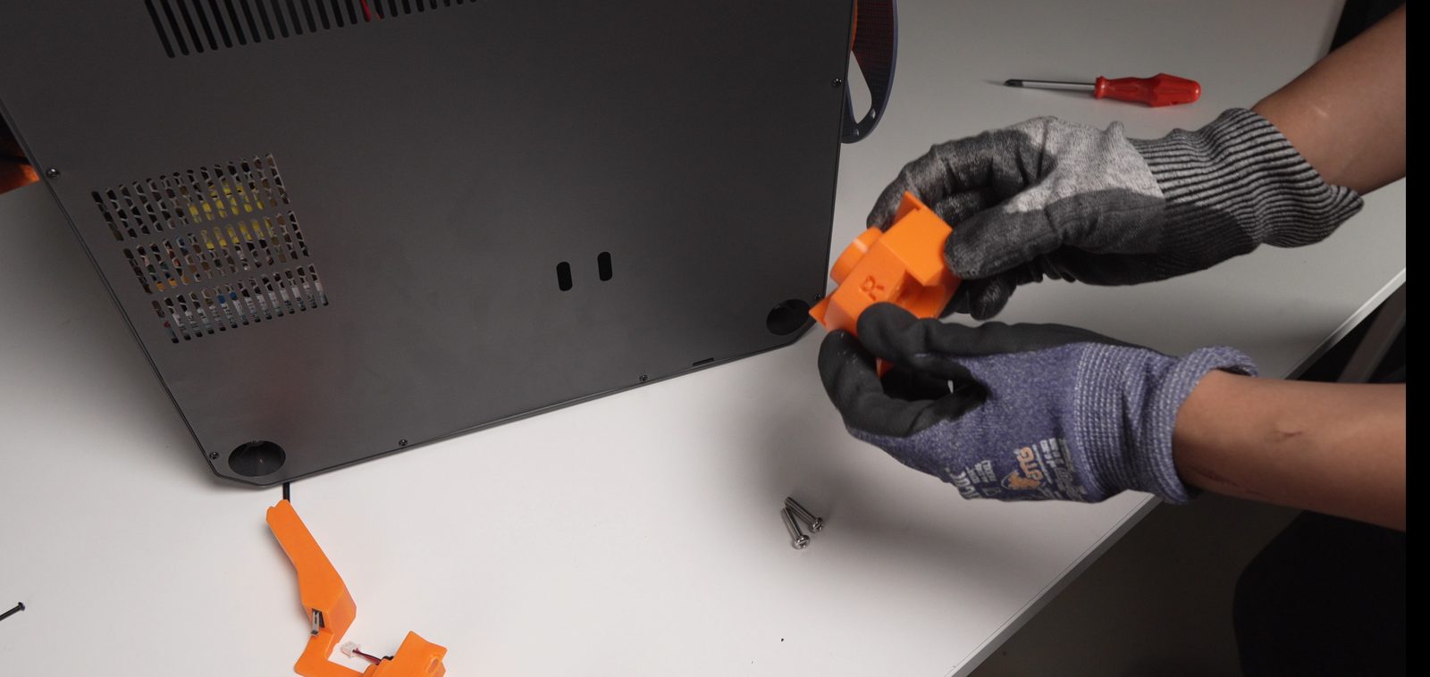 Removing the rubber feet at the back