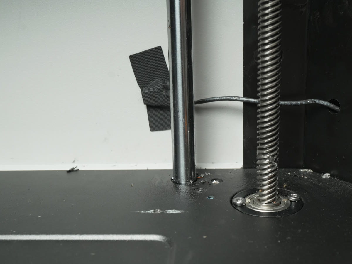 Wire harness routed past the Z-axis lead screw and held by an adhesion strip, H2S
