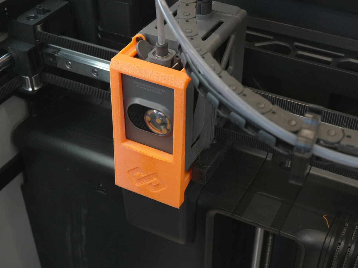 Scraper attached on top of the print head and secured with the top two screws, H2S