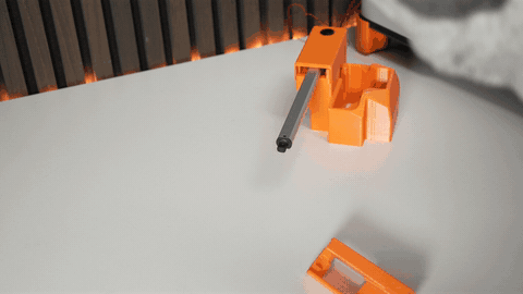 Actuator sliding into the bracket and orientation check (cable at the designated gap)