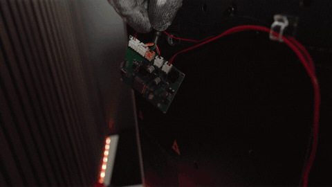 Wire harness taped to the printer frame at intervals and held by zip ties at stress points