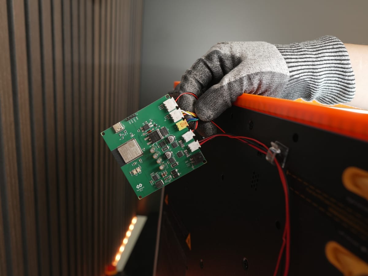 PCB holder positioned against the back panel
