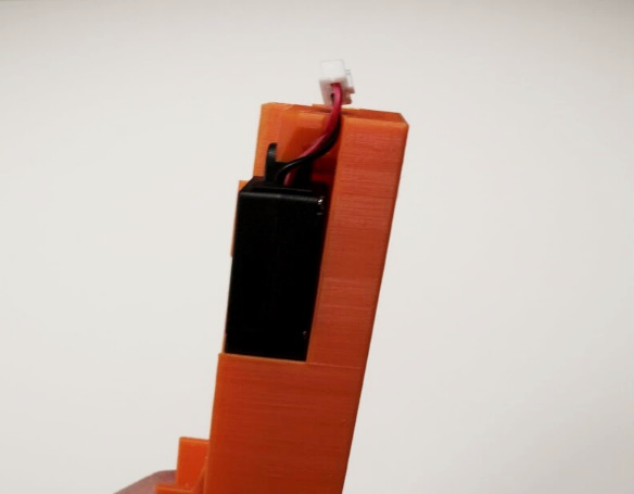 Actuator secured at the top of the holder