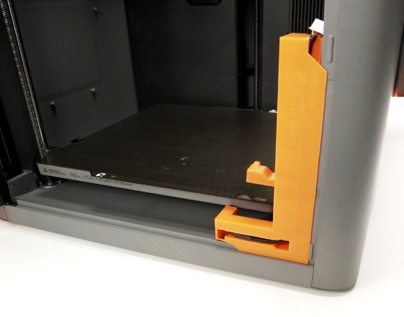 Double-sided tape applied to the printer frame