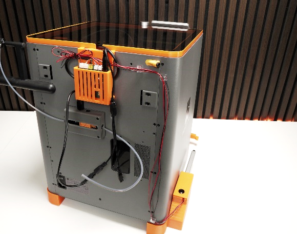 Printer with both tilted feet installed and cables routed