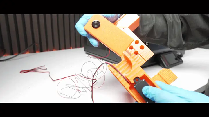 Sliding the actuator into the bottom part of the door opener until fully seated
