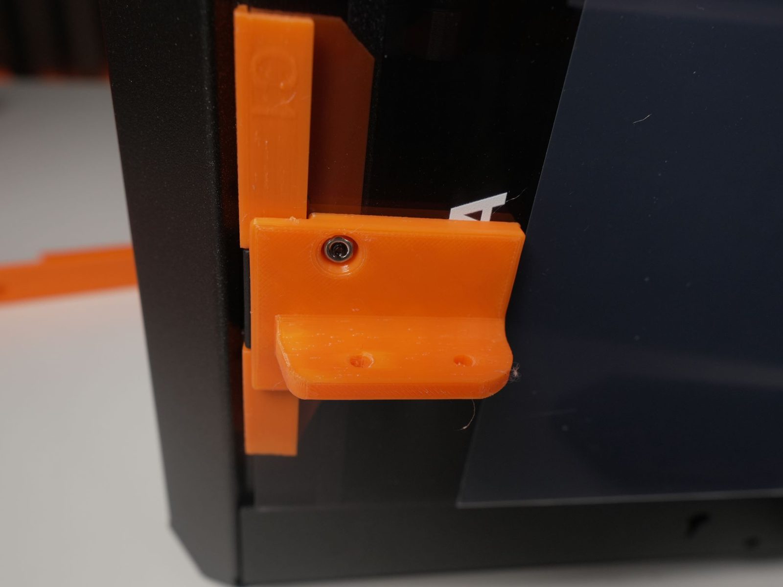 Door bracket connected to the bottom hinge with 2 BT3 bolts and nuts
