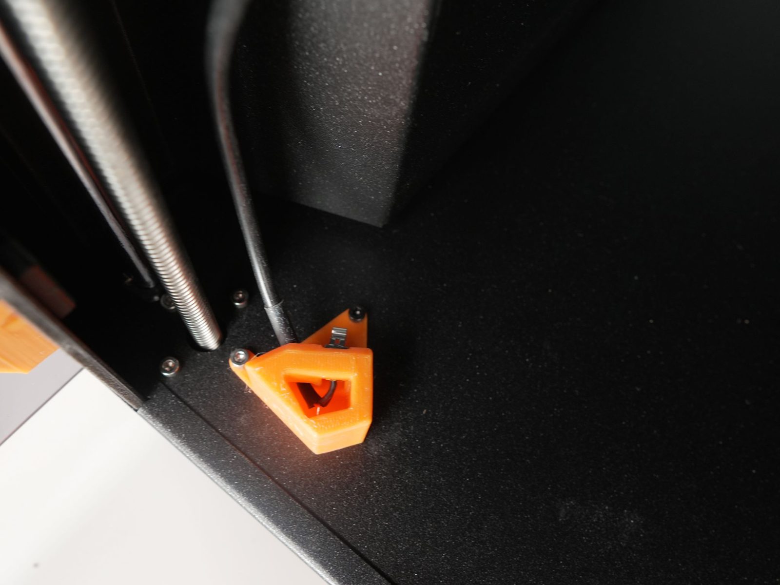Switch holder secured with the original bolt plus one extra bolt from the kit