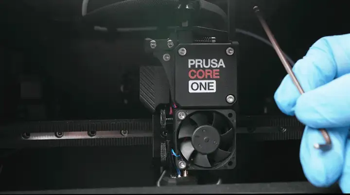 Unscrewing the 2 bolts for the print-head fan