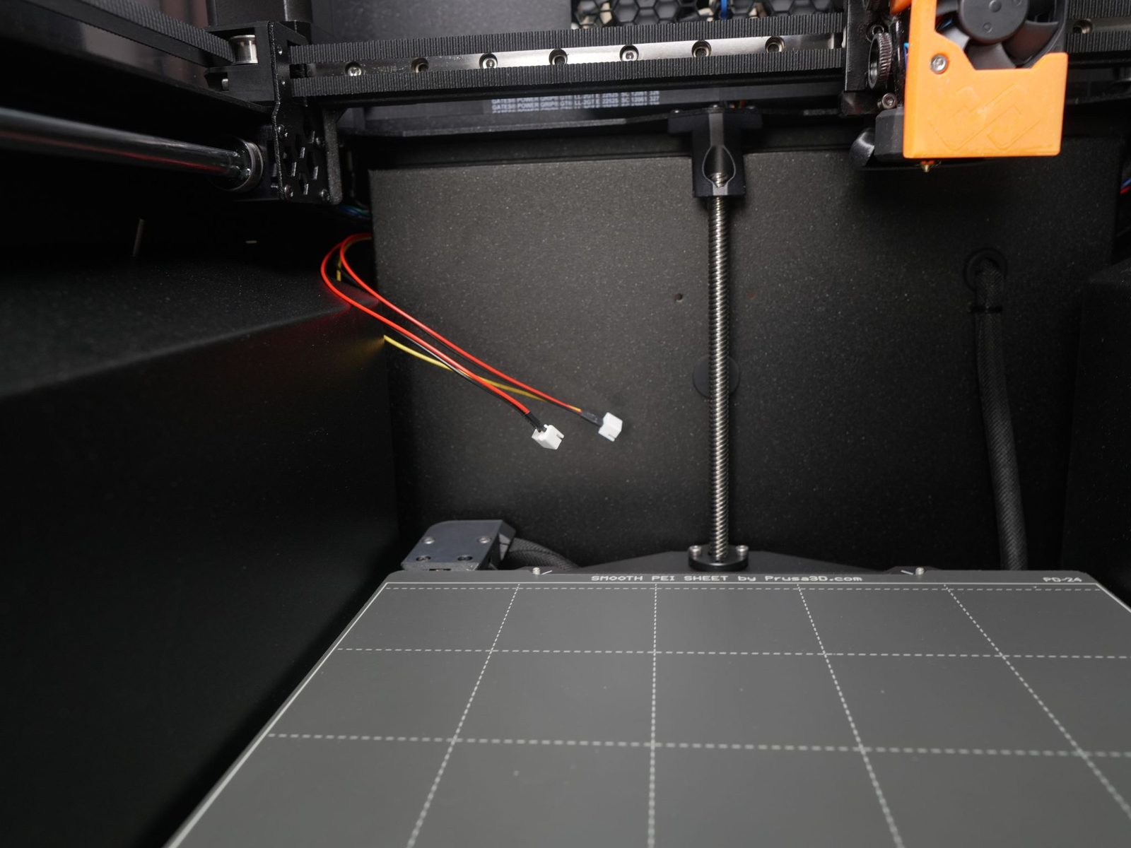 Wire harness inserted into the print room through the opening