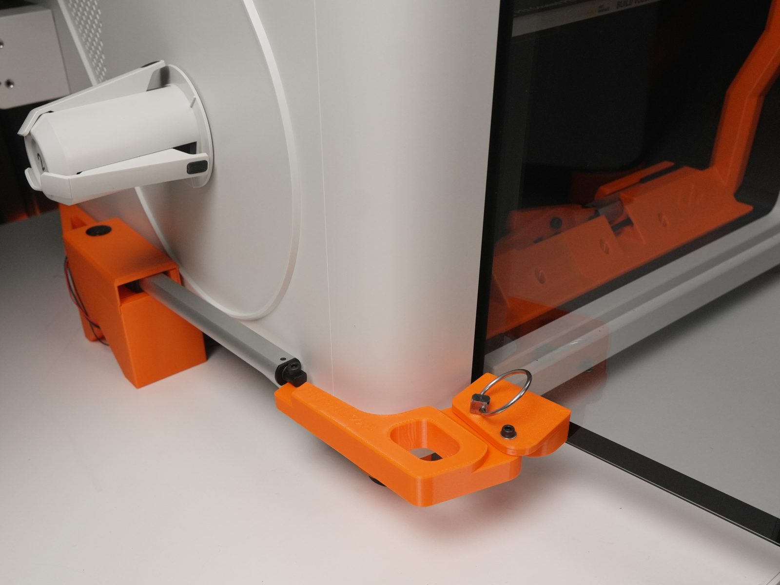 Quick-release pin inserted into the left hole