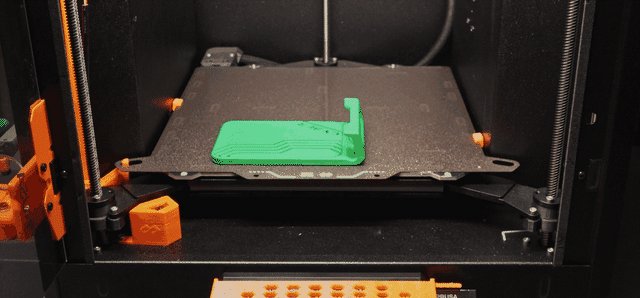 The custom BIQU plate at work: FarmLoop Stage 2 bending and clearing a print on the Prusa Core One